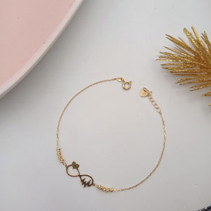 Pulsera de Infinito con Corazón, Electrocardiogama y Balines Dorados en Oro 18k