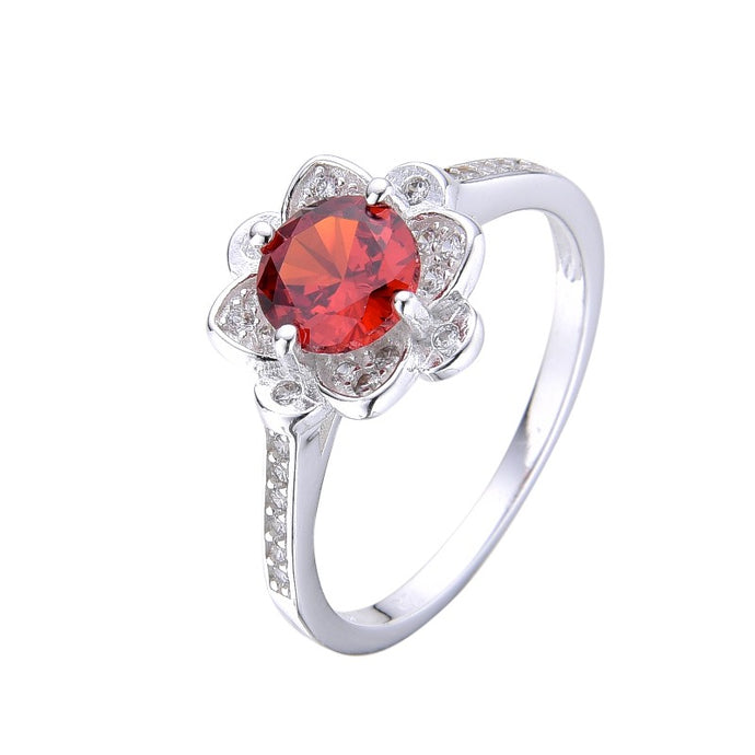 Anillo de Flor con Circón Rojo en Plata 925