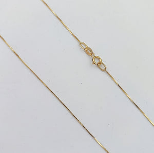 Cadena con dije de Punto Luz Estrella en Oro 18k